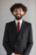 Alain M. Acanda, Sequor Law attorney, professional headshot in pinstripe suit
